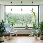 Modern interior with indoor plants, monstera, palm trees.