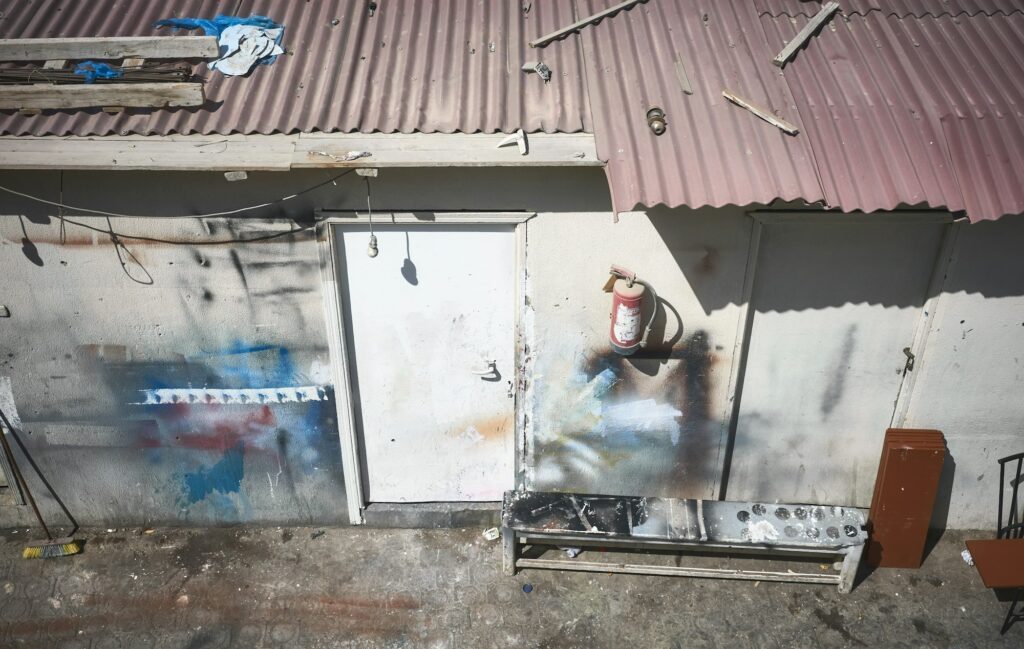 Narrow run-down back alley seen from above.